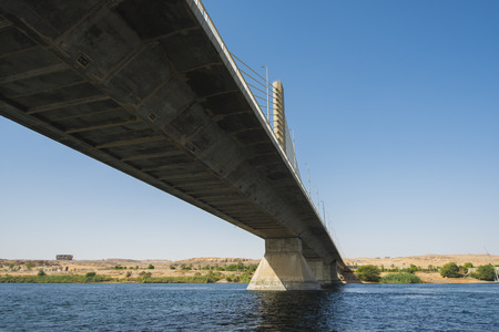 Large cable stayed road bridge spanning a wide Nile river on a clear day in Egypt