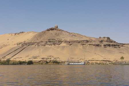 View from the Nile Rive of Tombs of Nobles mountain in Aswan Egyptの写真素材