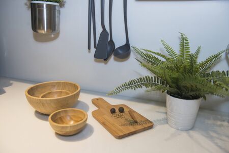 Abstract closeup detail still life of wooden chopping board in kitchen with spices onの写真素材