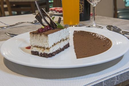 Tiramisu dessert food at luxury a la carte restaurant with cocoaの写真素材