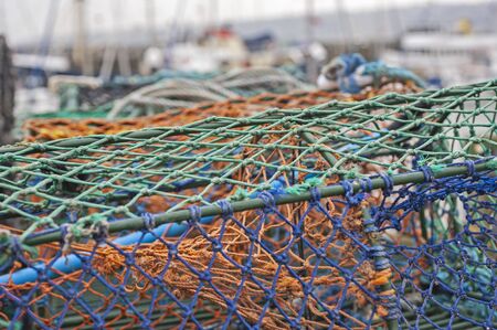 Closeup detail of lobster pots on a seaside harbor quaysideの写真素材