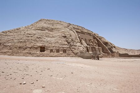 Exterior entrance to ancient egyptian temple of Ramses II in Abu Simbel with giant statues