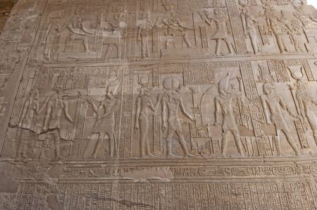 Hieroglypic carvings on wall at the ancient egyptian temple of Kom Ombo in Aswan