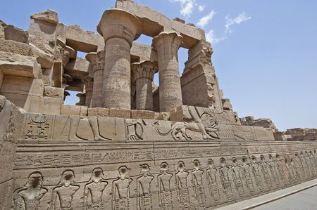 Hieroglypic carvings on wall at the ancient egyptian temple of Kom Ombo in Aswan
