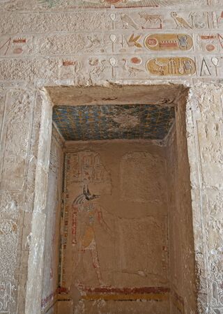 Hieroglypic carvings on doorway wall at the ancient egyptian Temple of Hatshetup in Luxorの写真素材