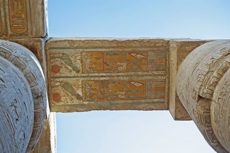 Hieroglypic carving and paintings on ceiling wall at the ancient egyptian Karnak temple in Luxor...