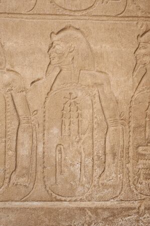 Hieroglypic carvings on wall at the ancient egyptian Karnak temple in Luxor