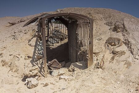 Remains of an old abandoned military army underground bunker dugout in the desert of africaの写真素材