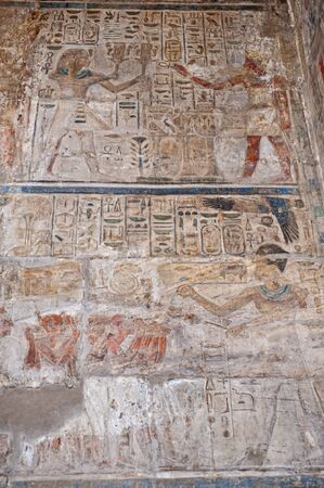Hieroglypic carving paintings on wall at the ancient egyptian Luxor Temple
