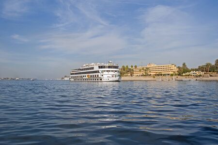 Large luxury traditional Egyptian river cruise boat sailing on the Nileの写真素材