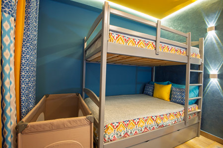 Interior design decor furnishing of luxury show home bedroom showing furniture and bunk beds in childs roomの写真素材