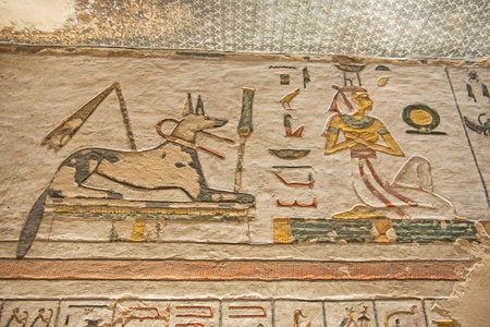 Hieroglypic carvings on wall in the ancient egyptian tomb of ramses III in Luxor Valley of the Kings