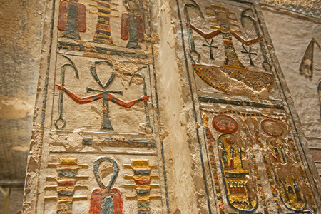 Hieroglypic carvings on wall in the ancient egyptian tomb of ramses III in Luxor Valley of the Kingsの写真素材