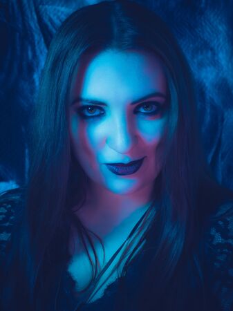 a fortune teller predicts the future using a magic ball, cards, and amulets. form for the designer.  The concept of magic and occultism. Divination. photomodelsの写真素材