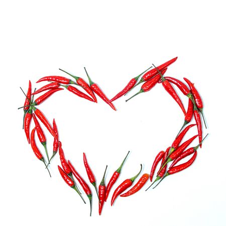 heart sign of red chili peppers on a white background. blank for designers. free space for text