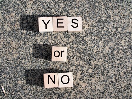yes, no text on blue background. Yes No Balance concept on wooden blocks.の写真素材