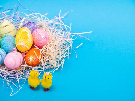 Easter Chicks and Eggs in Nest.concept of the Easter holiday and greeting cards. decorative chickens with Easter eggsの写真素材