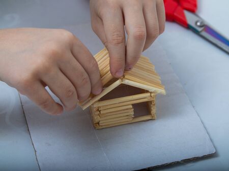 step-by-step instructions for creating a house from bamboo sticks. children's creativity, manual work, online classes. step 8. construction of the roof of the house from bamboo sticksの写真素材