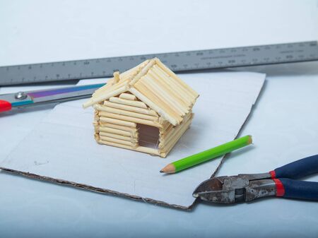 step-by-step instructions for creating a house from bamboo sticks. children's creativity, manual work, online classes. step 9. the bamboo stick house is readyの写真素材