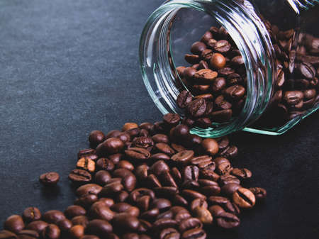 coffee from a glass jar on a black background. coffee mood. coffee backgroundの写真素材