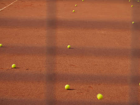 yellow balls for tennis on the courtの写真素材