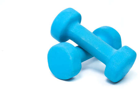 blue fitness dumbbells on a white background. the concept of a healthy lifestyle. fitness attributesの写真素材