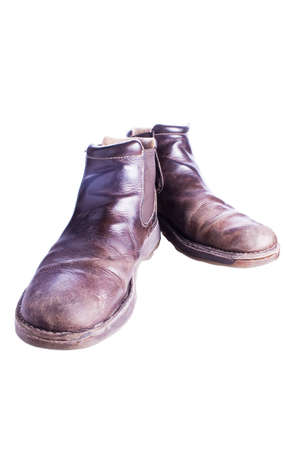 A well worn pair of brown leather bootsの写真素材