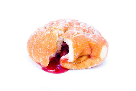 A delicous donut with strawberry jam centreの写真素材