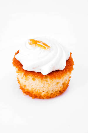 A cream cup cake isolated on white の写真素材