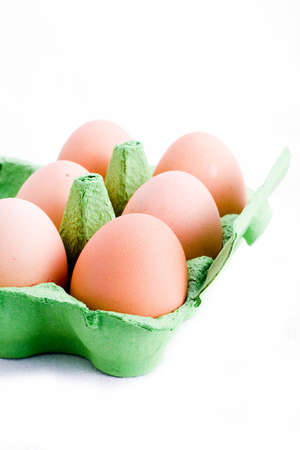 A carton of free range eggs isolated on whiteの写真素材