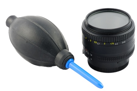 Isolated lens cleaning kit on a white background