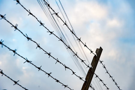 Metal fence with spike pointing to the skyの写真素材