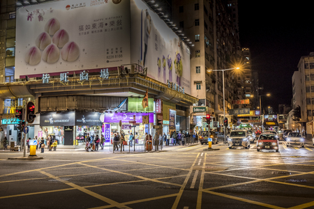 HONG KONG, CHINA - DEC 25, 2012: Crowded people walk through the market on December 25, 2012 in Mong Kok, Hong Kong. Mong Kok, Hong Kong is the highest population density place in the world.のeditorial素材