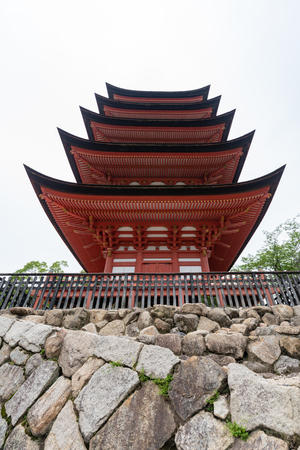 Miyajima, Japan - JUNE 27 2017: Toyokuni Shrine five-story pagoda at Torii Gate at Miyajima, Hiroshima, Japan at the floating gate of Itsukushima Shrine.のeditorial素材
