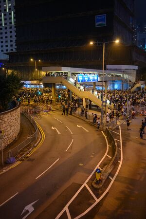 HONG KONG - June 12, 2019: Anti-Extradition Bill Protest in Hong Kong. Protestors are pushed by...