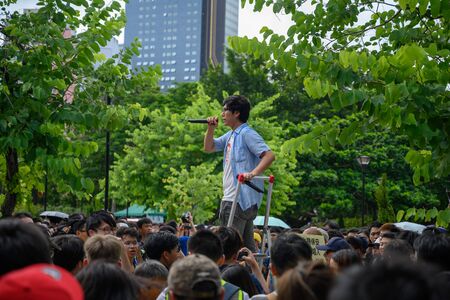 Tuen Mun, Hong Kong - July 6 2019: the crowd protest and occupy the Tuen Mun public park. The protesters took to the streets of Hong Kong to oppose a controversial extradition bill.のeditorial素材