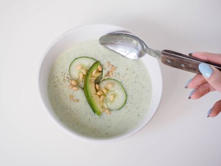 Cucumber yogurt vegetarian soup. White backgroundの写真素材