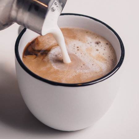 Making cup of coffee with milk. Cappuccinoの写真素材