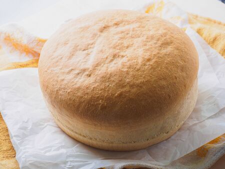 loaf of white bread on a table.