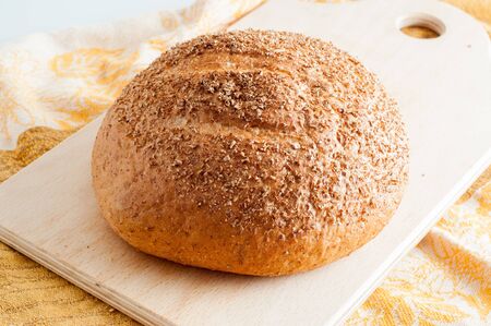 loaf of white bread on a table.