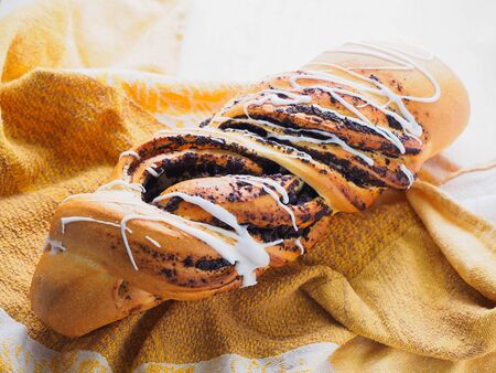 loaf of white poppy bread on a table.の写真素材