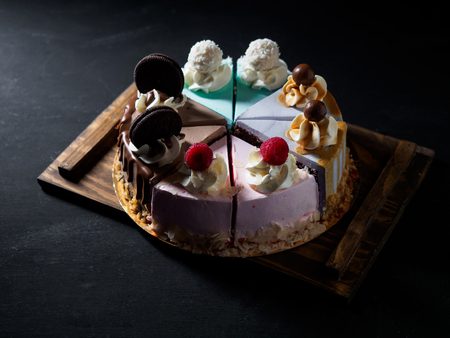 Set of pieces cakes on black background.の写真素材