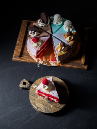 Set of pieces cakes on black background.の写真素材