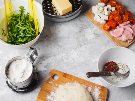 pizza ingredients. cherry ham sauce greens dough cheese flour.の写真素材