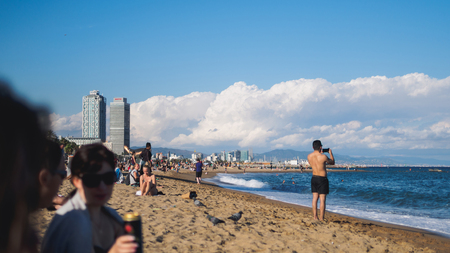 BARCELONA, SPAIN - SEPTEMBER 19: Many tourists and locals enjoying on famous beach in Barcelona, Spain on September 19, 2017.のeditorial素材