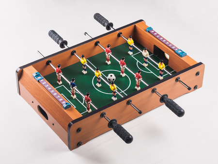 Mini table football foosball soccer with players and ball. isolated.の写真素材