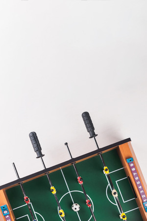 Mini table football foosball soccer with players and ball. isolated.