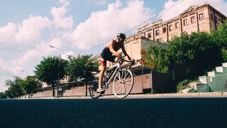 KAZAN, RUSSIA - AUGUST 5, 2018: Last part of triathlon race - by bycicle in the city.のeditorial素材