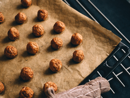 Hot prepared meat balls on baking sheet with paper.の写真素材