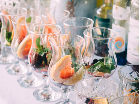Wedding ceremony furshet tables with food drink.の写真素材